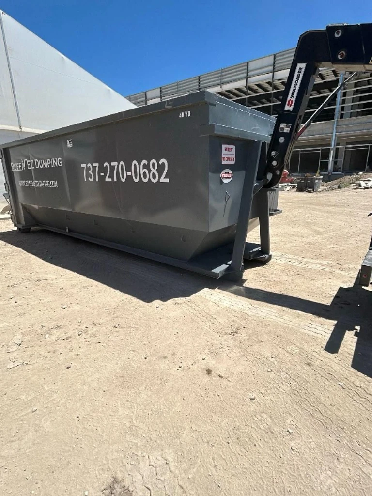 40 Yard construction roll-off dumpster on active job site with Swaploader equipment