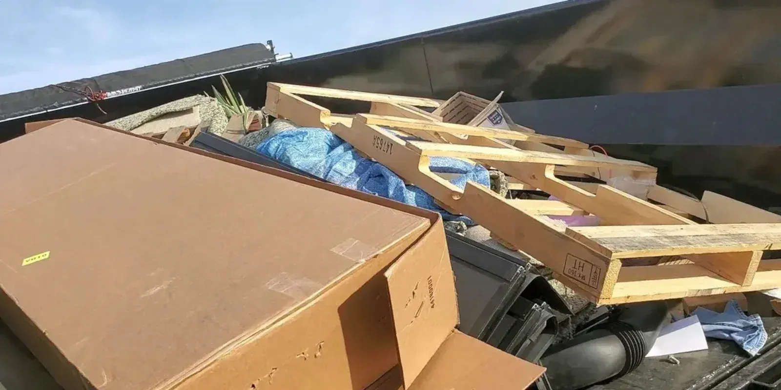 Ruff'N EZ roll-off dumpster positioned on residential property in Central Texas